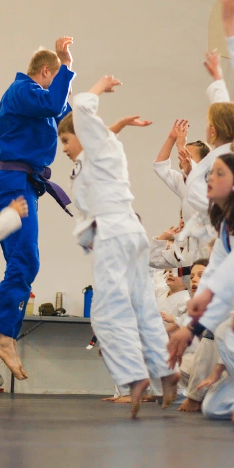 Kids BJJ class celebrating during training